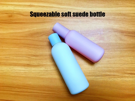 Squeezable soft suede bottle